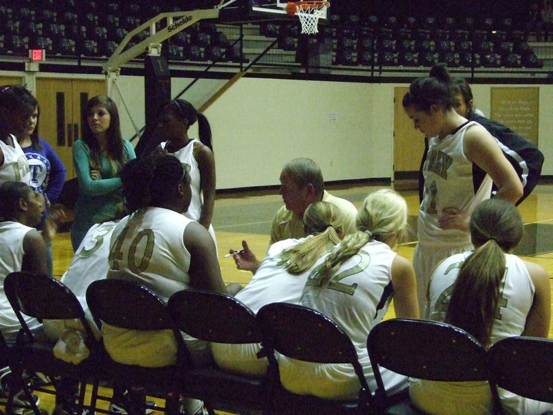 Image: Coach Randy Parks goes over the plays.