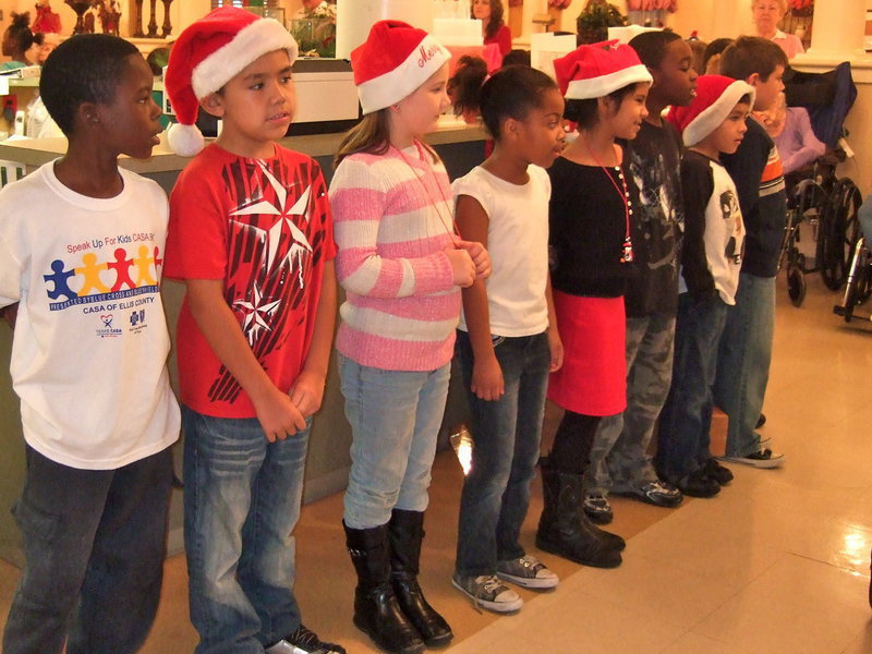 Image: Stafford 2nd graders singing Rudolph the Red Nosed Reindeer.
