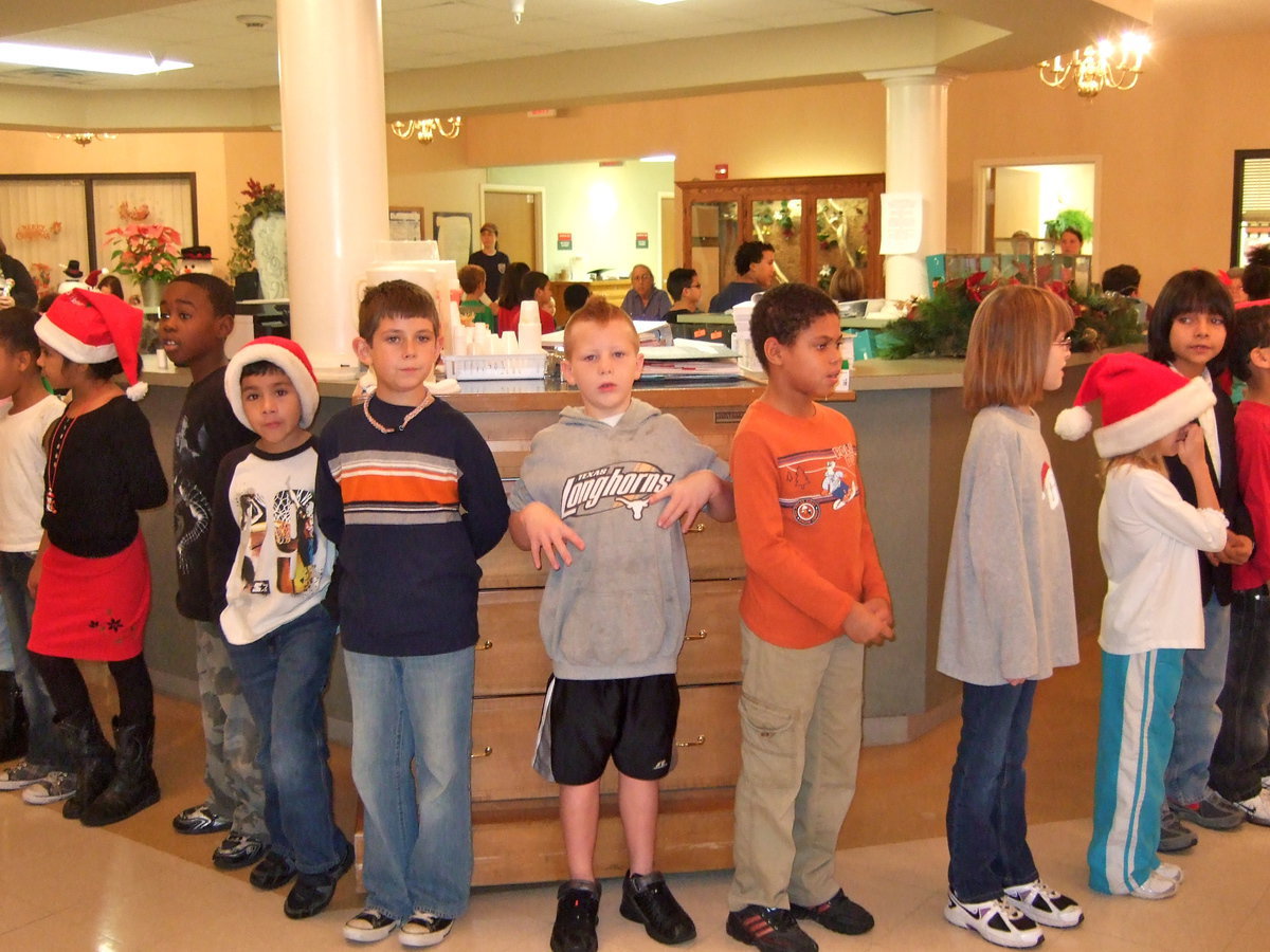 Image: Stafford 2nd graders getting ready to sing Rocking Around the Christmas Tree.