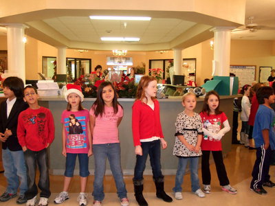 Image: Stafford 2nd graders singing We Wish you a Merry Christmas.