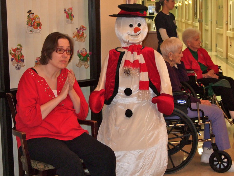 Image: This resident got to sit next to Frosty the Snowman and enjoy the show.