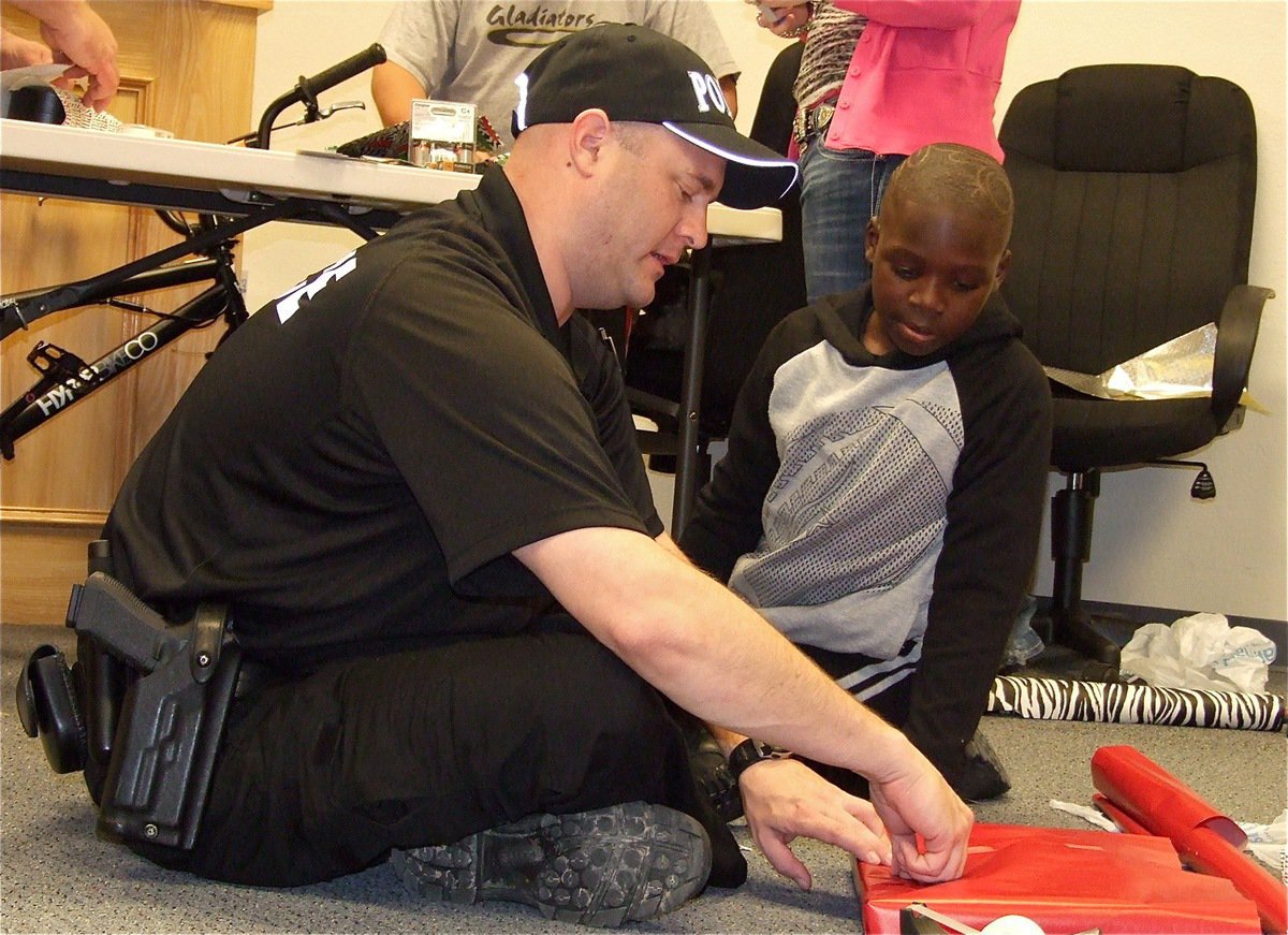 Image: Officer Shawn Martin lends a helping hand to Byron.