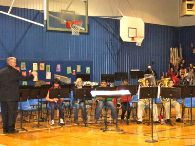 Image: The Milford 7th grade band playing Christmas March, Holly Jolly Christmas and We Wish You A Merry Christmas.