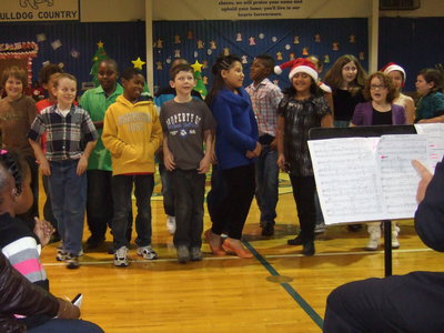 Image: Fourth graders singing, There’s Someone in the Chimney.