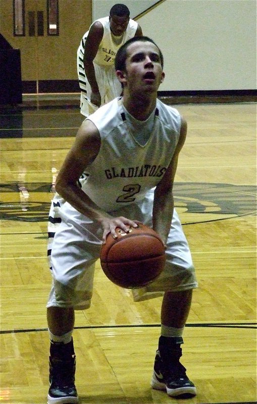 Image: Caden Jacinto(2) is focused at the free-throw line.
