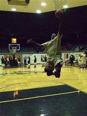 Image: Larry Mayberry, Jr.(13) shows his athleticism while shooting a pre-game layup.