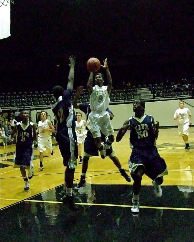 Image: Italy’s Eric Carson(2) penetrates into the lane for a score during JV hoops action.