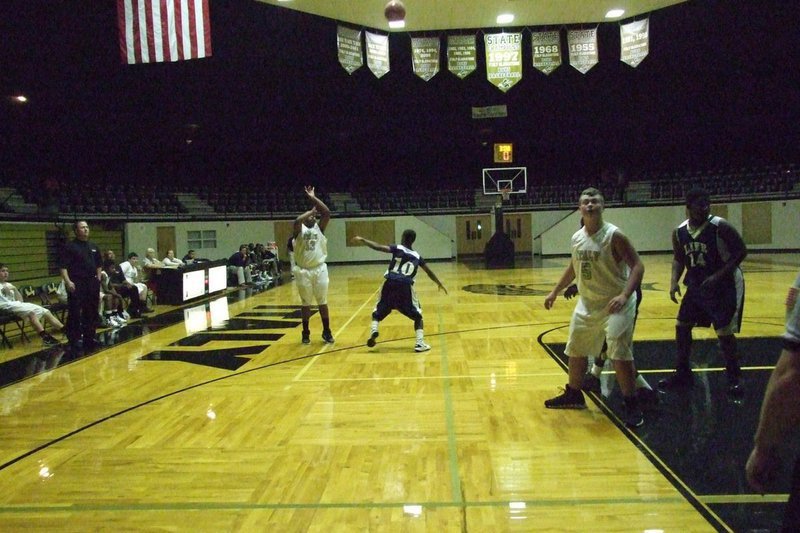 Image: JV Gladiator Darol Mayberry(13) hits a three-pointer.