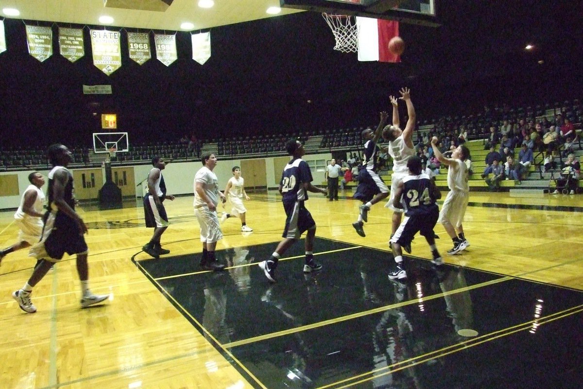 Image: Zain Byers(5) rips down a rebound for Italy’s JV Gladiators.