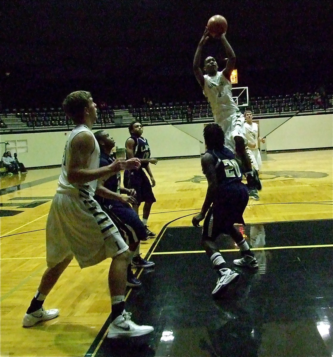 Image: Italy’s Trevon Robertson(1) rises for a score over Red Oak Life.