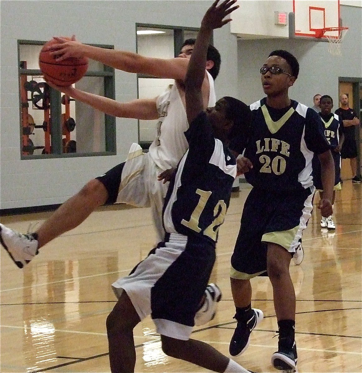 Image: Tyler Anderson(11) finishes the fast break against Red Oak Life Oak Cliff during the Ferris JV Boys Basketball Tournament.