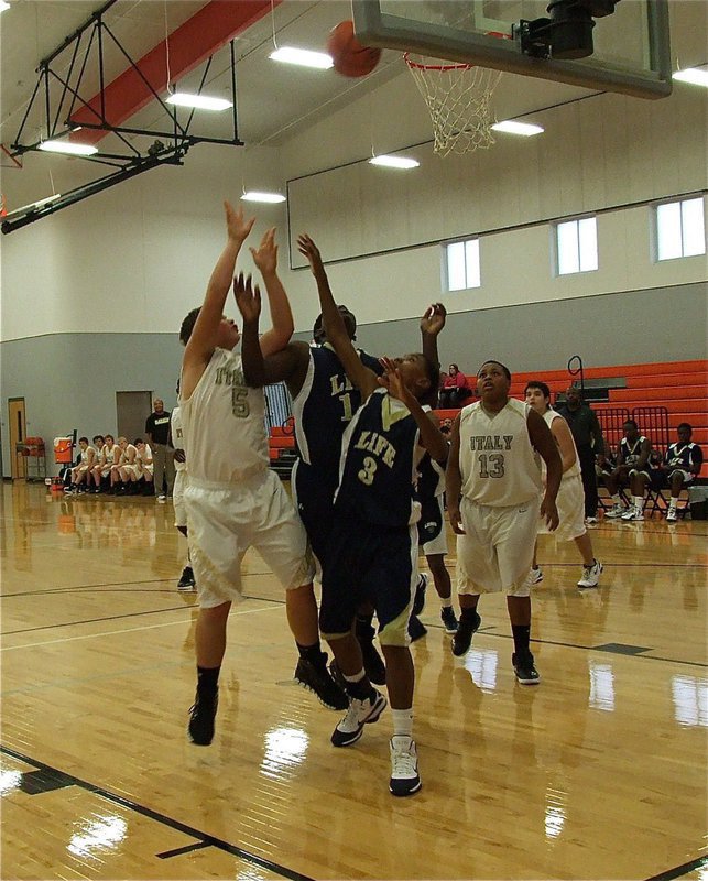 Image: Zain Byers(5) rebounds an Italy miss and quickly puts it in for 2-points.