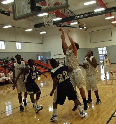 Image: Zain Byers(5) banks one in down low for the JV Gladiators.