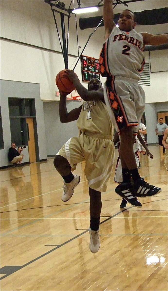 Image: Marvin Cox(1) outwits this Ferris defender to score the layup.