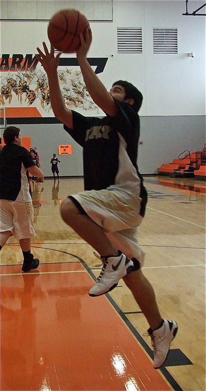 Image: Tyler Anderson gets warmed up before the championship game, practicing like he plays, full speed!