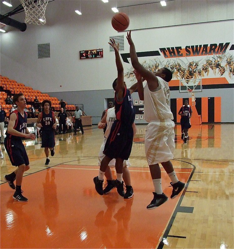 Image: Darol Mayberry(13) scores against the Mustangs.