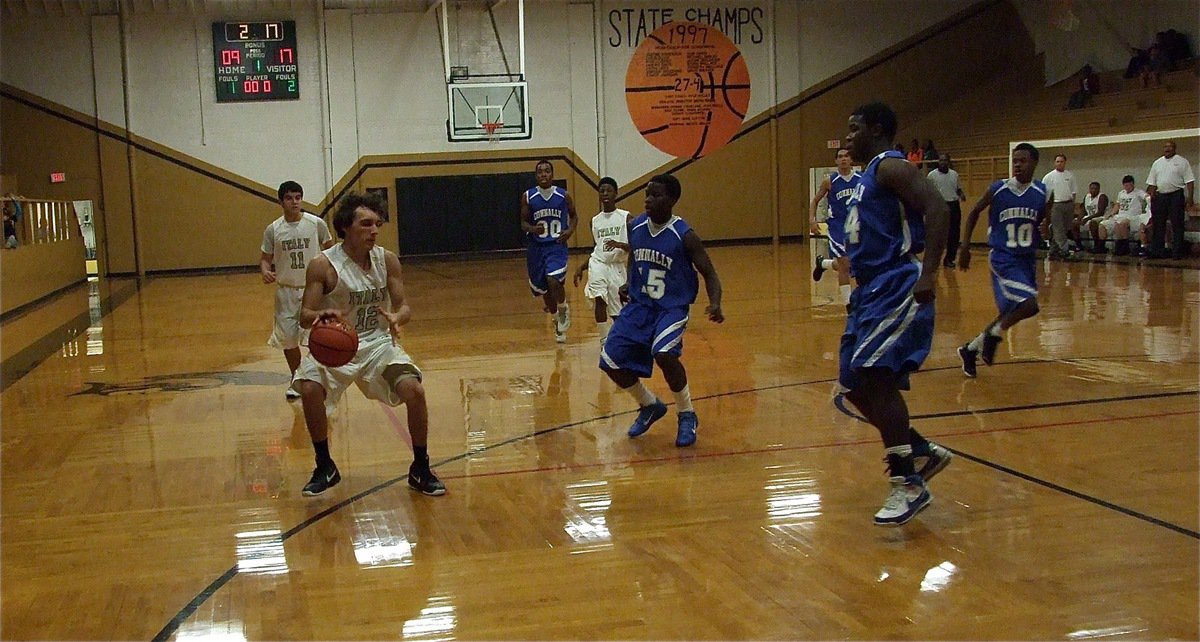 Image: Chace McGinnis(12) controls his  dribble and sets up the Italy offense against Connally.