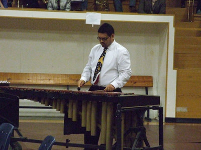 Image: Mr. Perez helped the 7th grade band during their presentation.