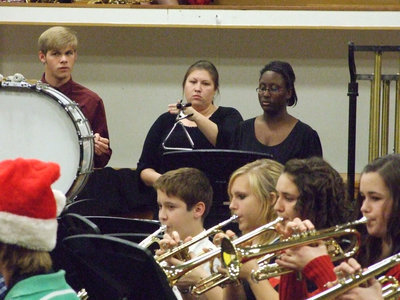 Image: The 8th grade trumpet section keeps up with the percussion.