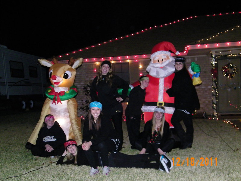 Image: Photo op at the Hellners — every year this crazy girls dress in all black and go around town to have their pictures made with the Christmas decorations of Italy residents.  Little did they know they were having their picture taken in front of the grand prize winners!!
    (L-R) Reagan Cockerham, Kelsey Nelson, Bailey Eubank, Jaclynn Lewis, Tara Wallis, Maddy Washinton, Reagan Adams. All freshmen at Italy ISD)