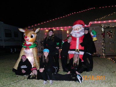 Image: Photo op at the Hellners — every year this crazy girls dress in all black and go around town to have their pictures made with the Christmas decorations of Italy residents.  Little did they know they were having their picture taken in front of the grand prize winners!!
    (L-R) Reagan Cockerham, Kelsey Nelson, Bailey Eubank, Jaclynn Lewis, Tara Wallis, Maddy Washinton, Reagan Adams. All freshmen at Italy ISD)