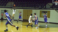Image: Is he flying? Could be. “Little K” Johnson(#5) jumps up for a steal against the Wildcats.