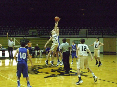 Image: 8th grade jump ball against Whitney.