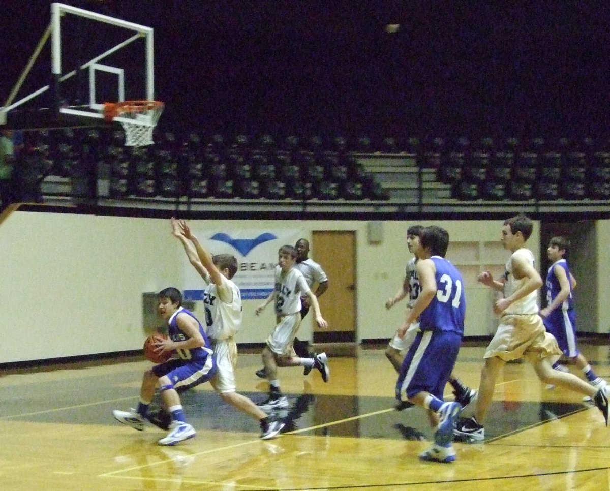 Image: The Gladiators guard the basket with all they have.