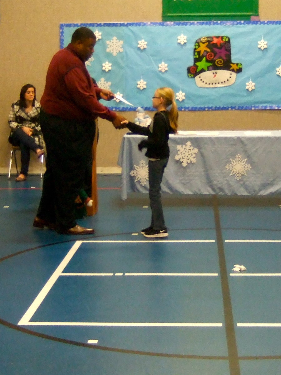 Image: Madelyn Chambers (fourth grader) happy to receive her awards.