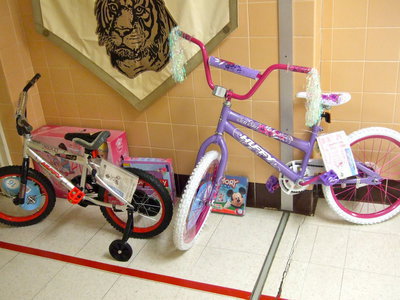 Image: Mr. Miller explained that these bikes and toys are awards for perfect attendance and good conduct awards. “We want the kids to understand if you are not in school you are not learning. If you are in school then you are going to be picking up the information you need for a bright future.”