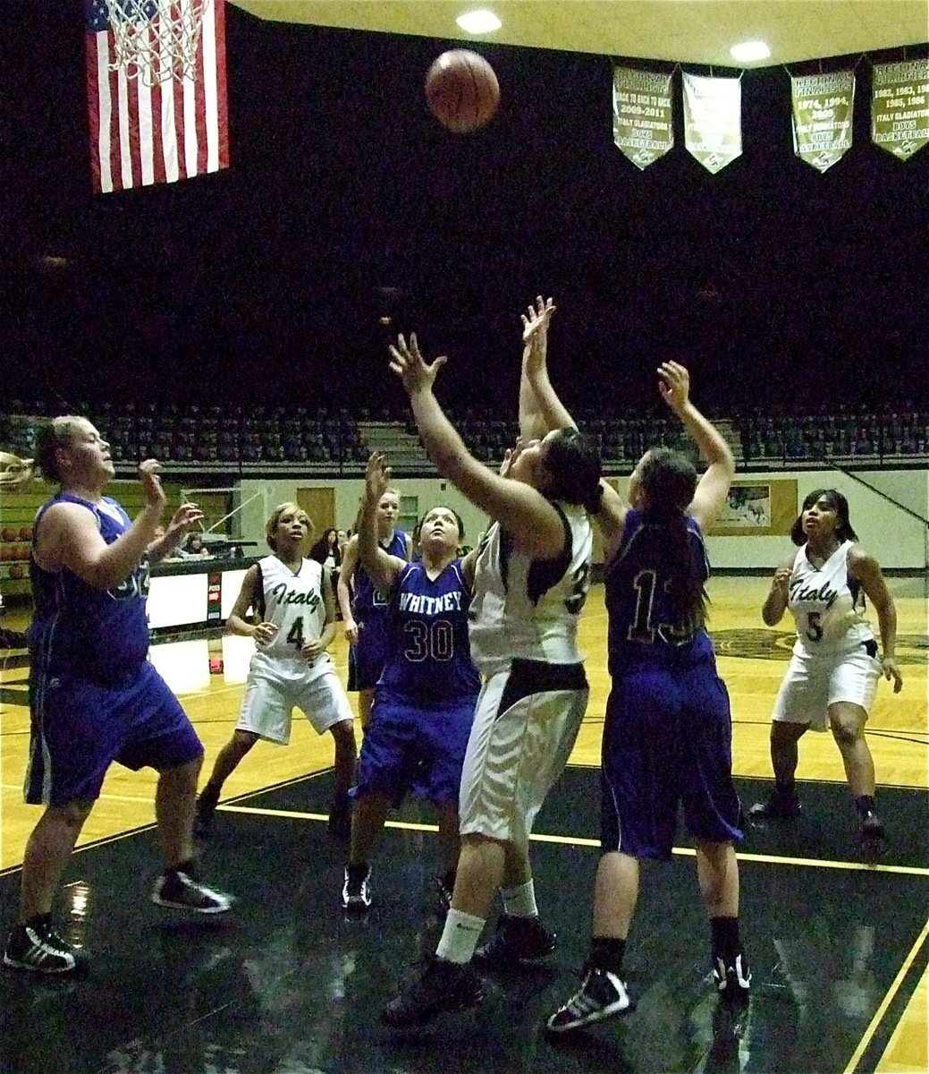 Image: JV Lady Gladiators Ryisha Copeland(4), Monserrat Figueroa(32) and Ashley Harper(5) hustle after a rebound against Whitney.