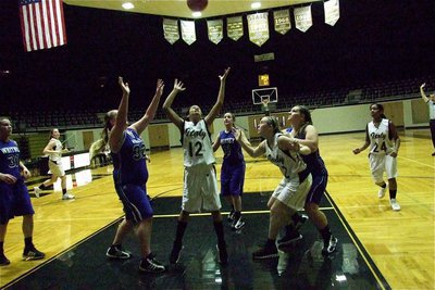 Image: JV Lady Gladiators Alex Minton(12) and Kelsey Nelson(22) go for the rebound.
