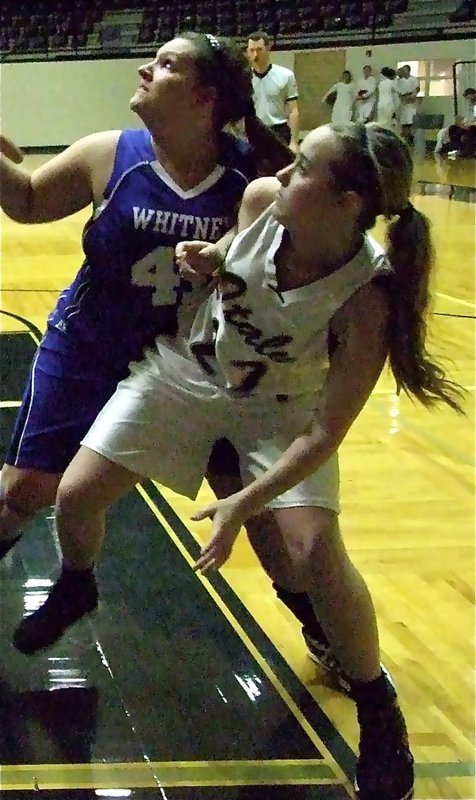 Image: Kelsey Nelson(22) keeps working the block for rebounding position.