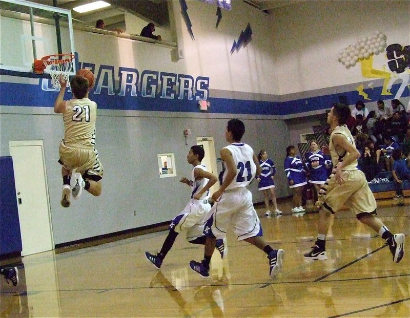 Image: Cole Hopkins(21) shows his athleticism while getting to the rim against Keene.