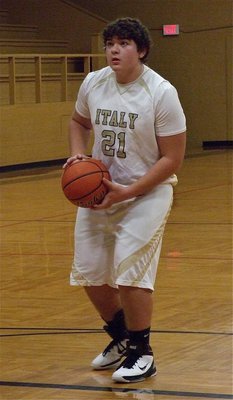 Image: JV Gladiator Kevin Roldan(21) takes aim from the free throw line.