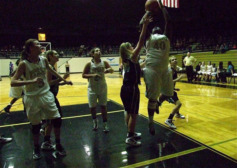 Image: Jimesha Reed(40) powers her way up for a score for the Lady Gladiators.