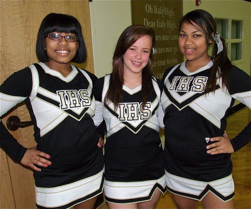 Image: Ashley Harper, Felicia Little and Destani Anderson cheer on the basketball squads.