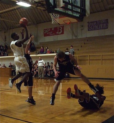 Image: JV Gladiator Tyvion Copeland(4) creates carnage under the rim against Grandview.