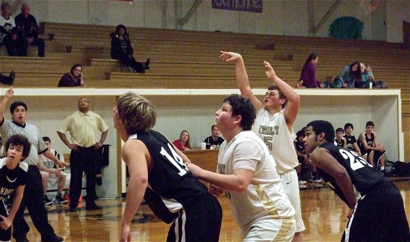 Image: JV Gladiators Zain Byers(5) shoots a free throw with is cousin John Byers(33) ready to rebound.