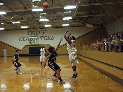 Image: Darol Mayberry(13) shoots his trademark three-ball over the Zebras.