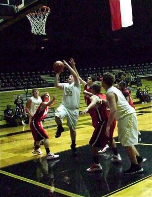 Image: JV Gladiator John Byers(33) slips inside for a score against Maypearl.