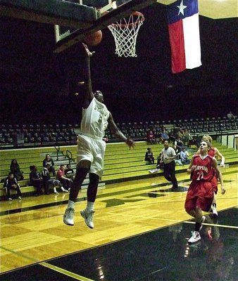 Image: JV Gladiator Marvin Cox(1) gets all the way to the rim for a fast break layup over Maypearl.