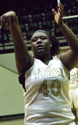 Image: Lady Gladiator Jimesha Reed(40) concentrates from the free throw line.