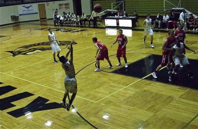 Image: Caden Jacinto(2) spots up for a three-pointer against Maypearl.