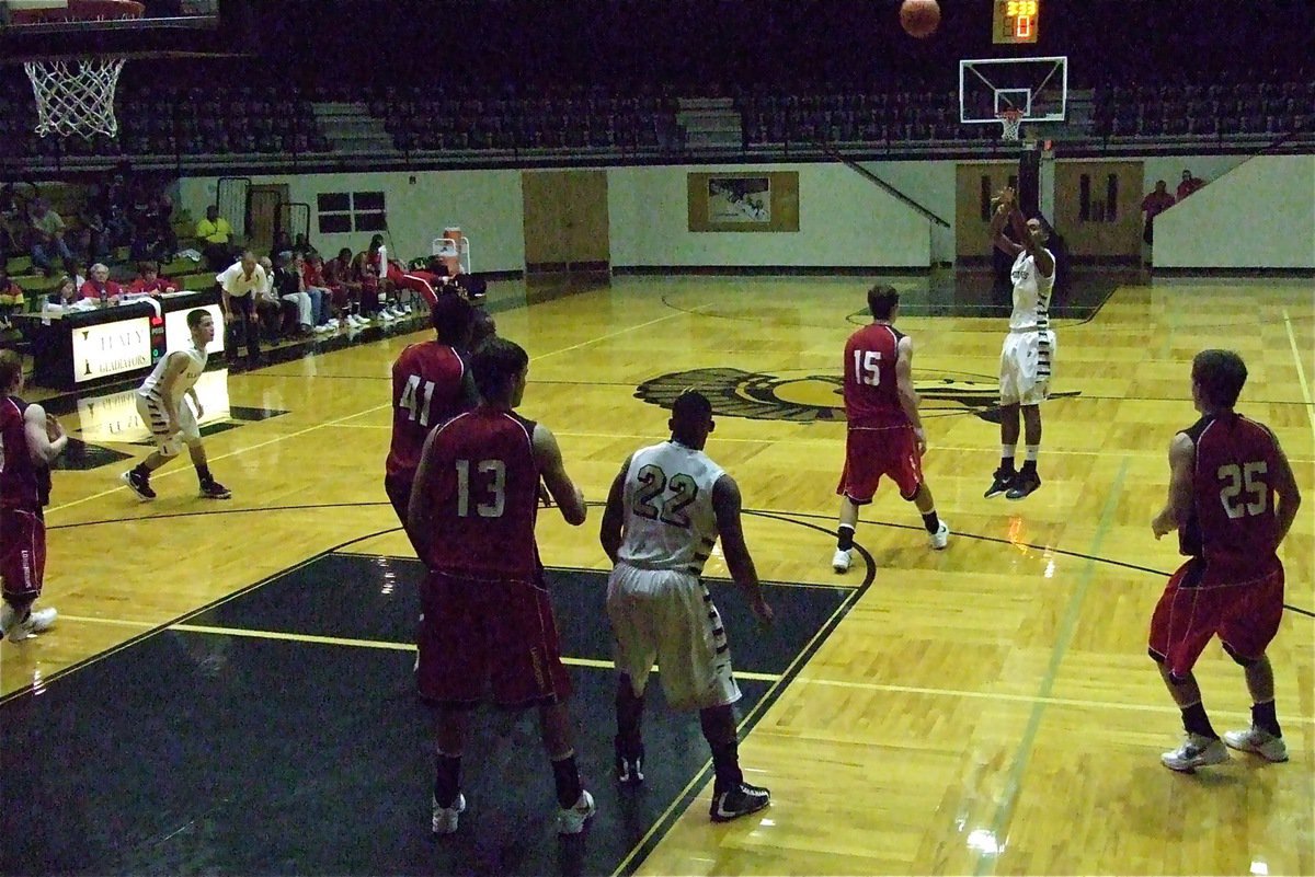 Image: Freshman Trevon Robertson knocks down one of his five three-pointers against Axtell in a 72-37 win at home. Robertson finished with 19-points.