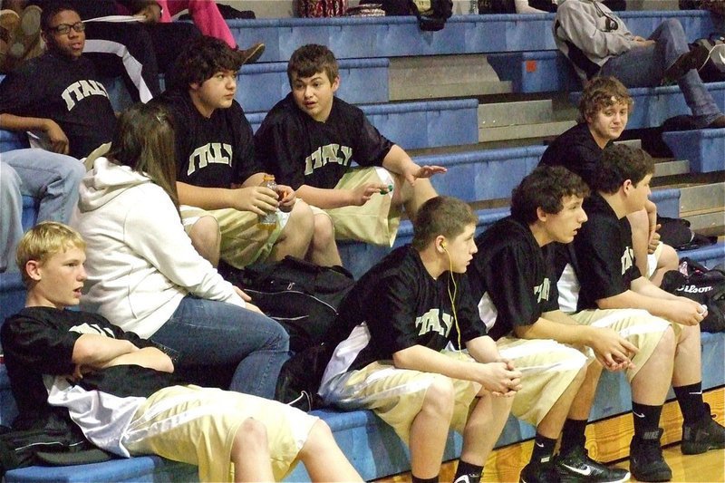 Image: The JV Gladiators stay calm before their game against Whitney while stormy weather raged on outside the facility. Italy won in dramatic fashion 57-55 with Bailey Walton (second step far right) scoring the game winner.