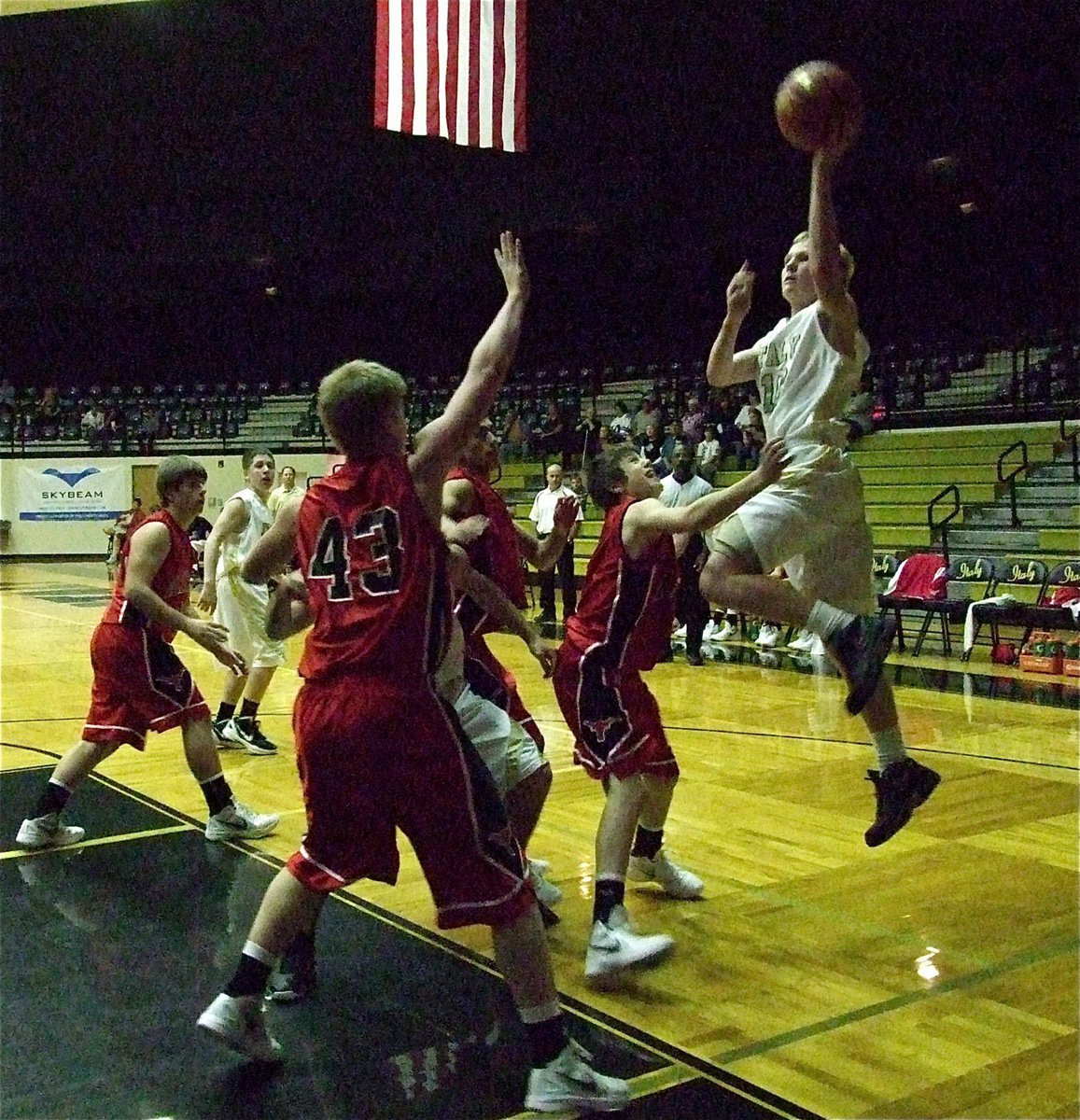 Image: Cody Boyd(10) drives the baseline against the JV Longhorns.