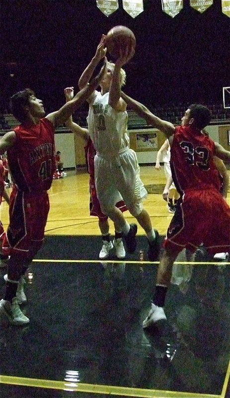 Image: Cody Boyd(10) continues his attack against Axtell.