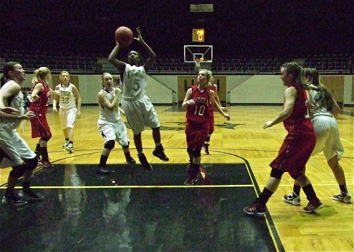 Image: Lady Gladiator point guard Jameka Copeland(5) slips into the lane for a score.