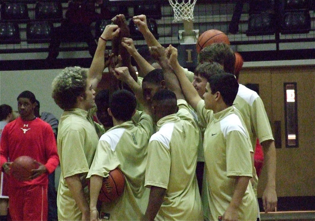 Image: Gladiator senior Brandon Souder (far left of the huddle) returns to active duty with his teammates after recovering from injury.